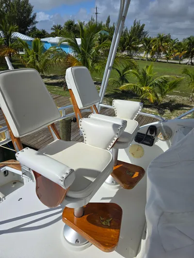 Bad To The Bone Yacht Photos Pics Captain's chairs on 1995 Egg Harbor Golden Egg 42 yacht, with tropical background.