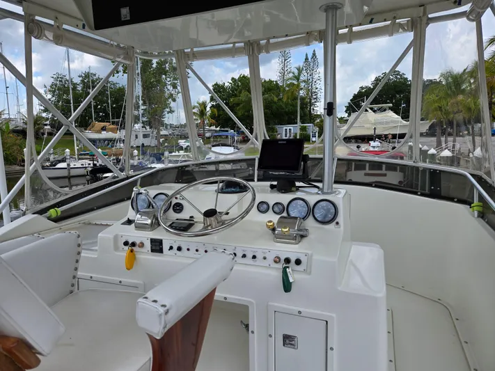 Bad To The Bone Yacht Photos Pics Cockpit of 1995 Egg Harbor Golden Egg 42 yacht with steering wheel and gauges.