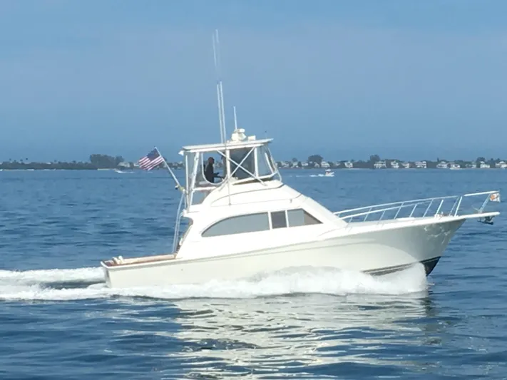 Bad To The Bone Yacht Photos Pics 1995 Egg Harbor Golden Egg 42 yacht cruising on calm waters.