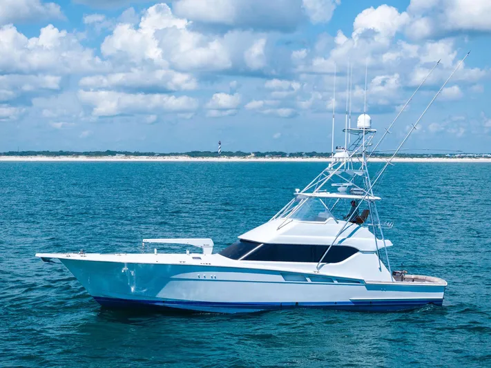 Endurance Yacht Photos Pics 1998 Hatteras 60 Convertible yacht on open water under a blue sky.