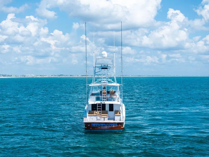 Endurance Yacht Photos Pics 1998 Hatteras 60 Convertible yacht on open sea under blue sky.
