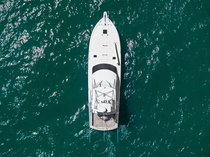 Endurance Yacht Photos Pics Aerial view of 1998 Hatteras 60 Convertible yacht on sparkling blue water.