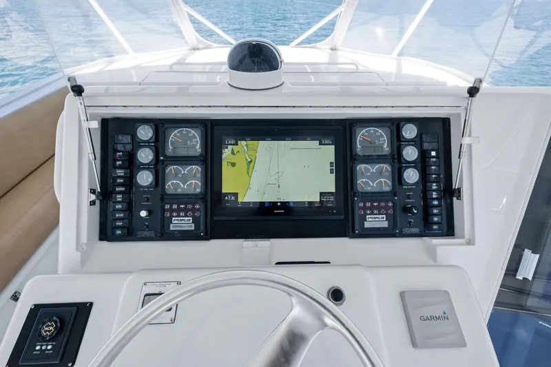 Endurance Yacht Photos Pics Control panel of a 1998 Hatteras 60 Convertible yacht with navigation and engine gauges.