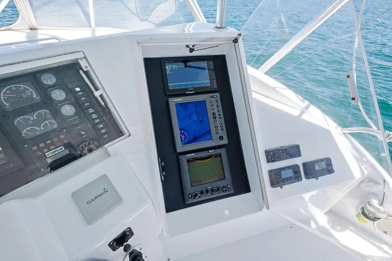 Endurance Yacht Photos Pics Control panel of a 1998 Hatteras 60 Convertible yacht with navigation equipment.