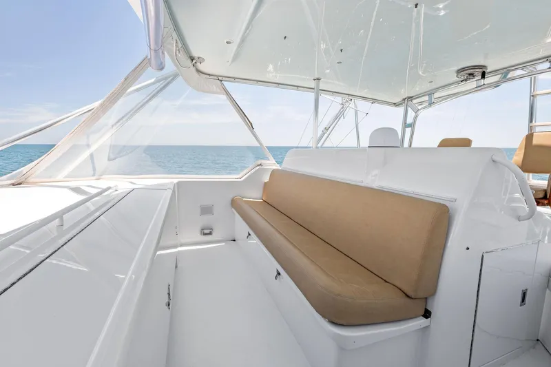 Endurance Yacht Photos Pics 1998 Hatteras 60 Convertible yacht interior with beige seating and ocean view.