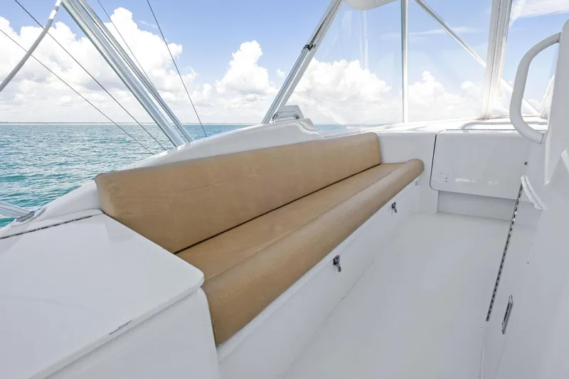 Endurance Yacht Photos Pics 1998 Hatteras 60 Convertible yacht interior with beige seating and ocean view.