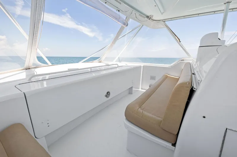 Endurance Yacht Photos Pics 1998 Hatteras 60 Convertible yacht interior with beige seating and ocean view.