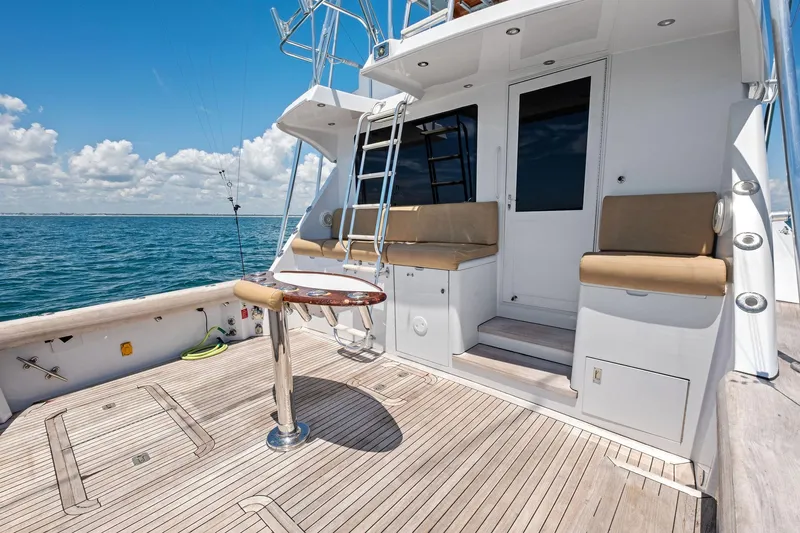 Endurance Yacht Photos Pics 1998 Hatteras 60 Convertible yacht deck with seating, table, and ocean view.