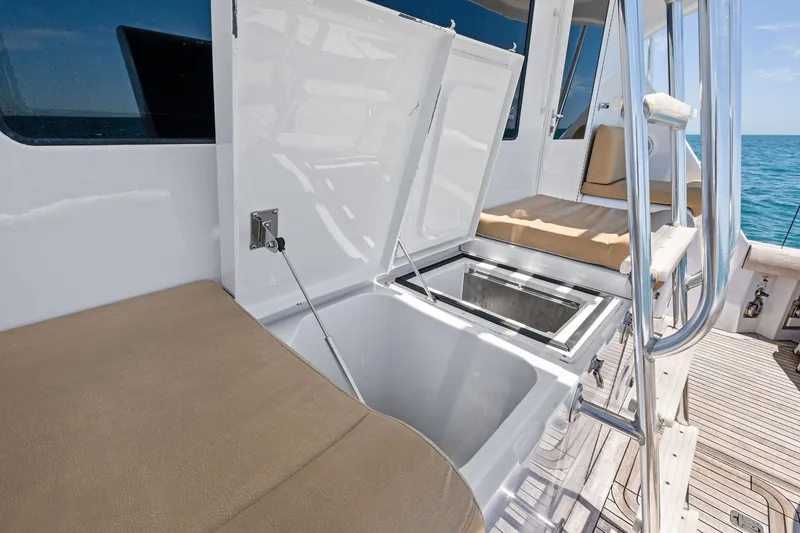 Endurance Yacht Photos Pics 1998 Hatteras 60 Convertible yacht deck with seating and storage compartments.