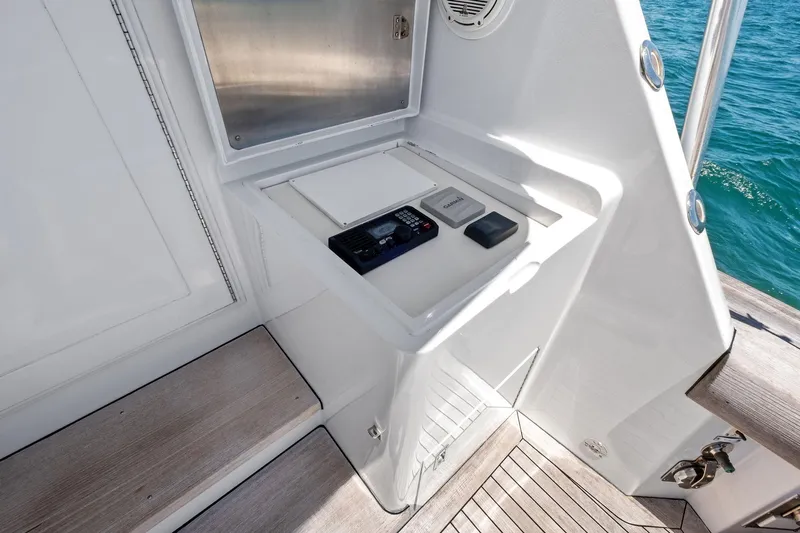 Endurance Yacht Photos Pics 1998 Hatteras 60 Convertible yacht deck with control panel and ocean view.