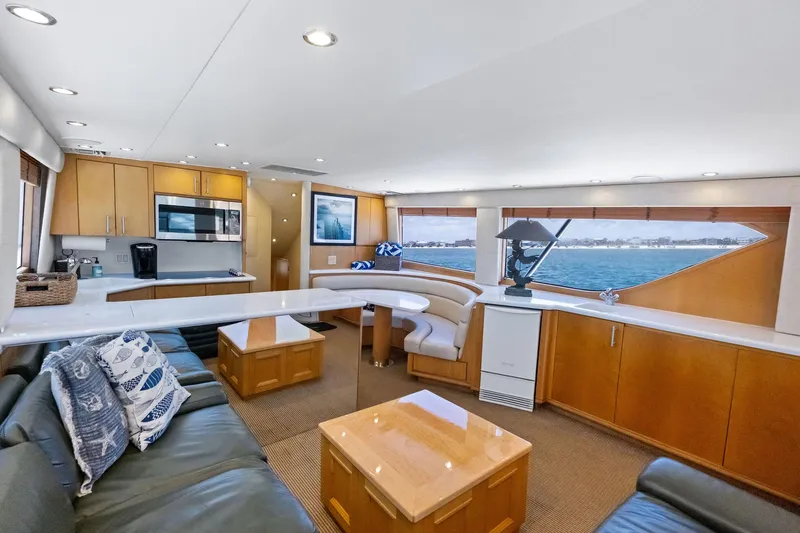 Endurance Yacht Photos Pics Luxurious interior of 1998 Hatteras 60 Convertible yacht with modern kitchen and ocean view.