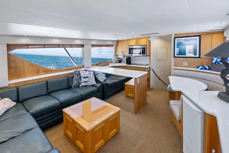 Endurance Yacht Photos Pics Luxurious interior of 1998 Hatteras 60 Convertible yacht with ocean view.