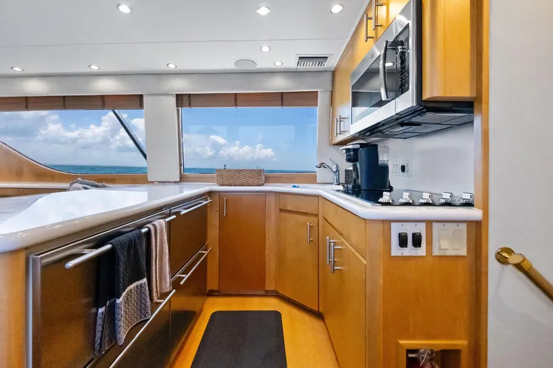 Endurance Yacht Photos Pics Luxurious kitchen interior of 1998 Hatteras 60 Convertible yacht with ocean view.