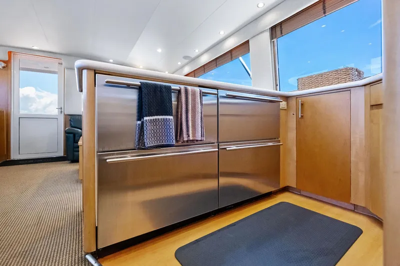 Endurance Yacht Photos Pics Interior of 1998 Hatteras 60 Convertible yacht kitchen with stainless steel appliances.