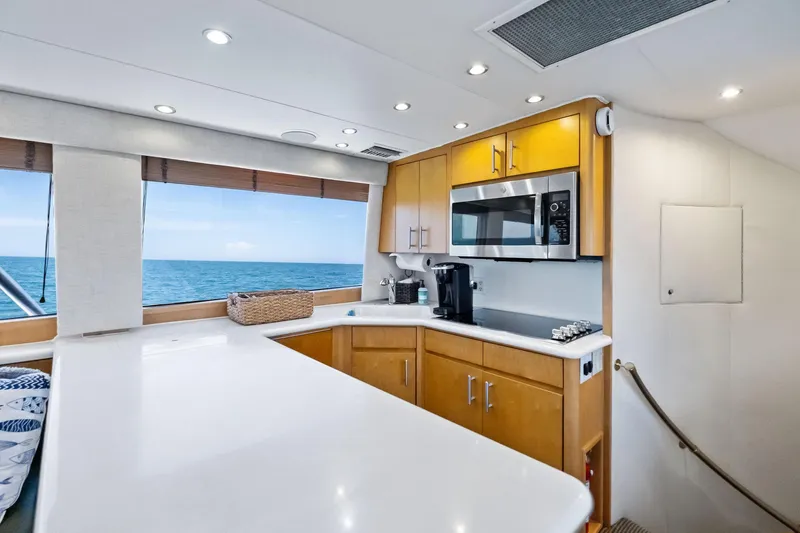 Endurance Yacht Photos Pics Luxurious kitchen interior of 1998 Hatteras 60 Convertible yacht with ocean view.