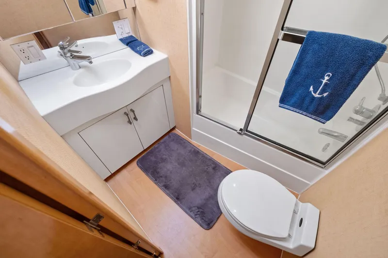 Endurance Yacht Photos Pics Bathroom interior of 1998 Hatteras 60 Convertible yacht with shower and sink.