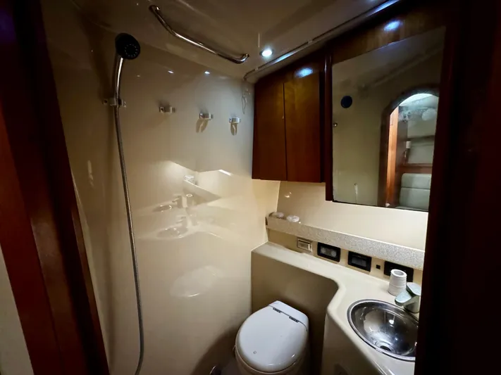 Los Gemelos Yacht Photos Pics Bathroom interior of 2006 Rampage 33 Express Barta Canyon Edition yacht, featuring shower and sink.