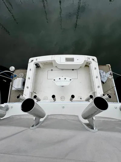 Los Gemelos Yacht Photos Pics 2006 Rampage 33 Express Barta Canyon Edition boat deck with fishing rod holders.