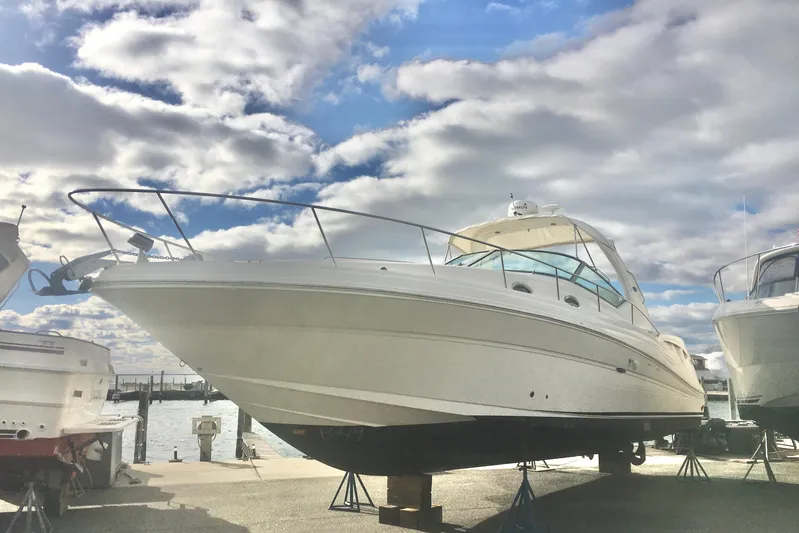  Yacht Photos Pics 2007 Sea Ray 340 Sundancer yacht on stands under a cloudy sky.