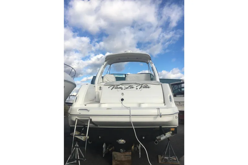  Yacht Photos Pics 2007 Sea Ray 340 Sundancer yacht on stands under a cloudy sky.