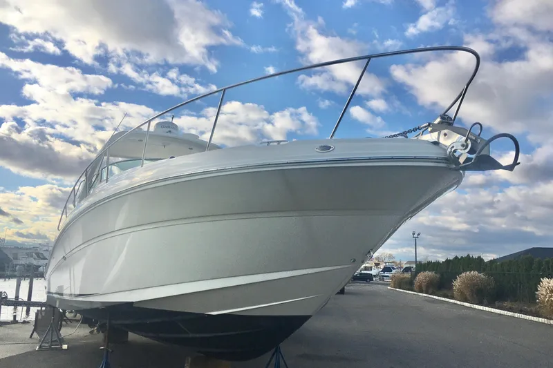  Yacht Photos Pics 2007 Sea Ray 340 Sundancer boat on stands under a partly cloudy sky.