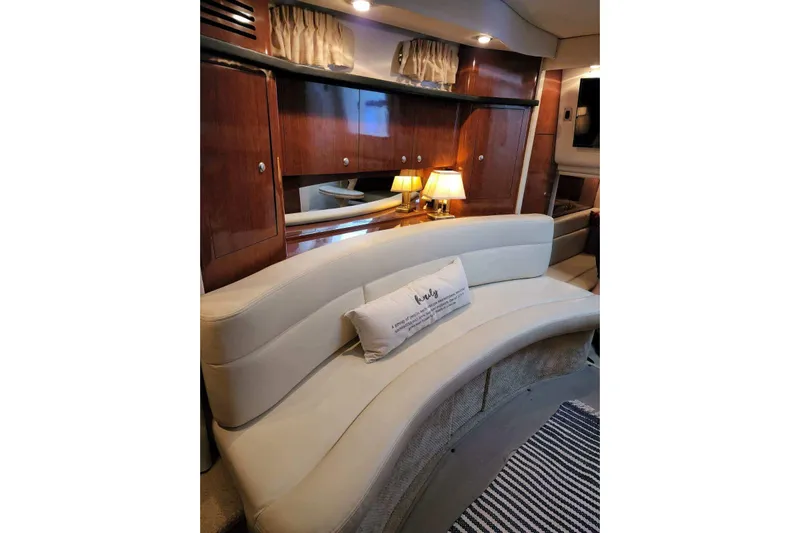  Yacht Photos Pics Luxurious interior of 2007 Sea Ray 340 Sundancer with elegant seating and warm lighting.