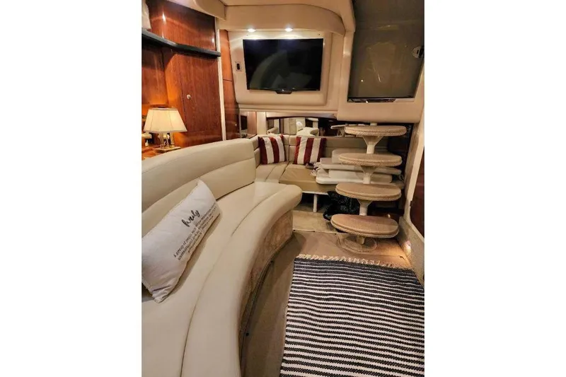  Yacht Photos Pics Luxurious interior of 2007 Sea Ray 340 Sundancer yacht with plush seating and elegant decor.