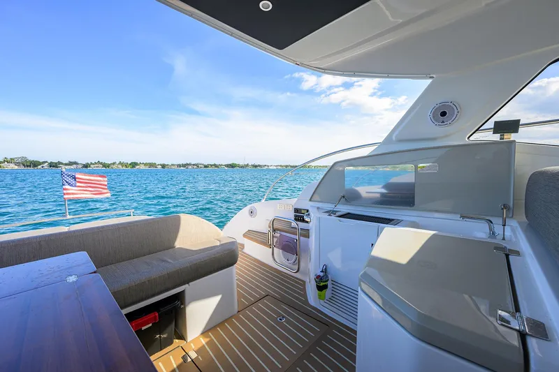 Chloe Yacht Photos Pics Azimut 45 Atlantis 2020 yacht interior with ocean view and American flag.