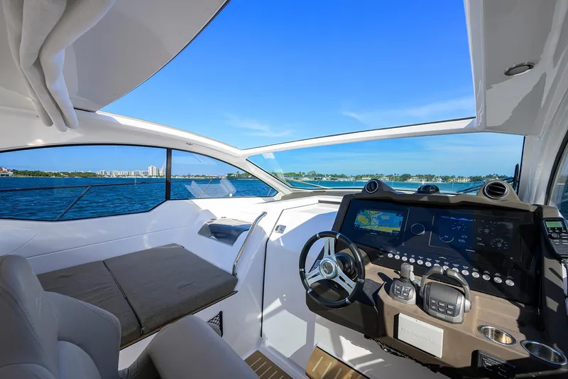 Chloe Yacht Photos Pics Interior view of 2020 Azimut 45 Atlantis yacht cockpit with modern navigation system.