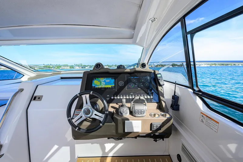 Chloe Yacht Photos Pics Helm of 2020 Azimut 45 Atlantis yacht with navigation controls and sea view.
