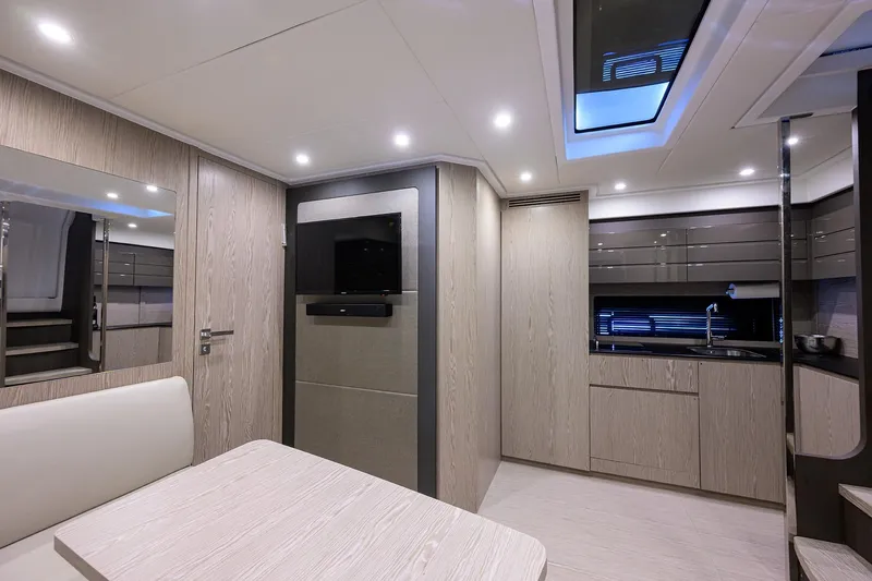Chloe Yacht Photos Pics Luxurious interior of 2020 Azimut 45 Atlantis yacht with modern kitchen and seating area.