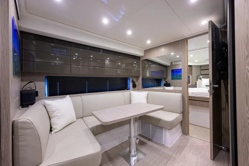Chloe Yacht Photos Pics Luxurious interior of 2020 Azimut 45 Atlantis yacht with modern seating and elegant decor.