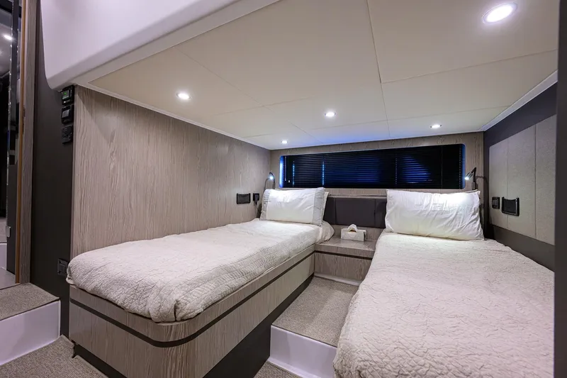 Chloe Yacht Photos Pics Luxurious twin cabin interior of 2020 Azimut 45 Atlantis yacht, featuring modern design and cozy bedding.