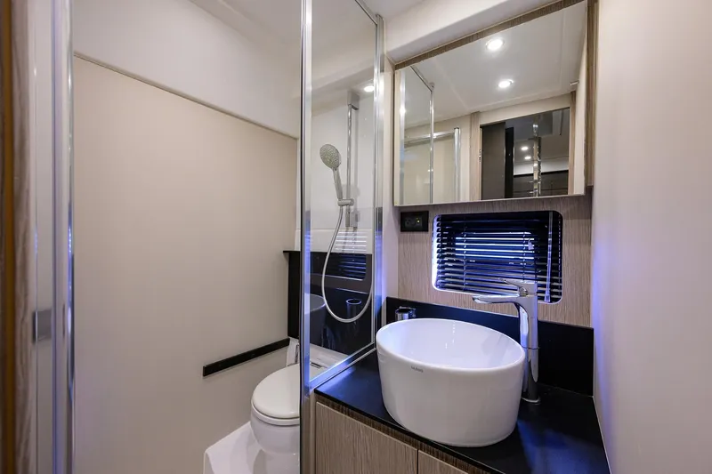 Chloe Yacht Photos Pics Luxurious bathroom in 2020 Azimut 45 Atlantis yacht with modern fixtures and elegant design.