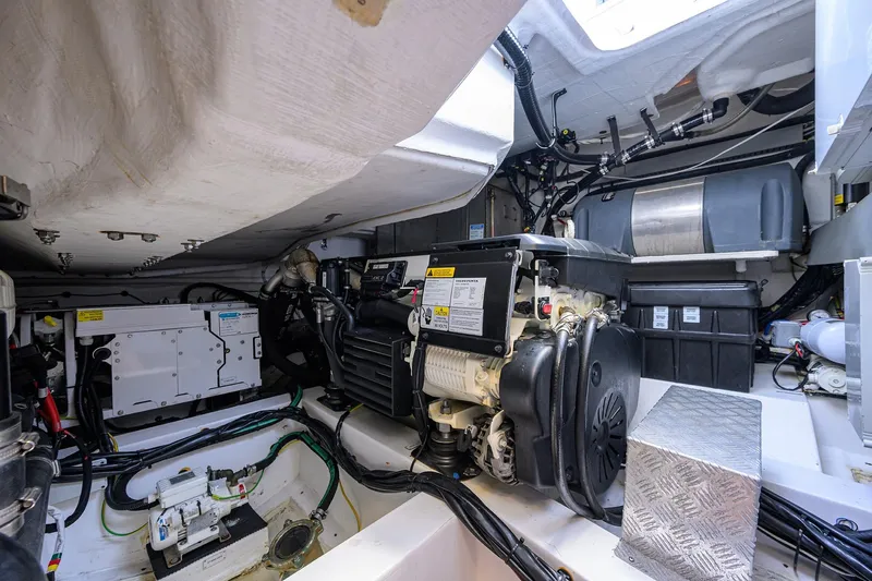 Chloe Yacht Photos Pics Engine room of 2020 Azimut 45 Atlantis yacht, showcasing mechanical components and wiring.