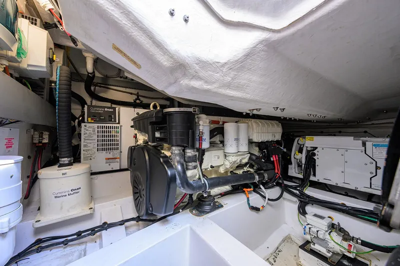 Chloe Yacht Photos Pics Engine room of 2020 Azimut 45 Atlantis yacht, featuring Cummins Onan generator and marine equipment.