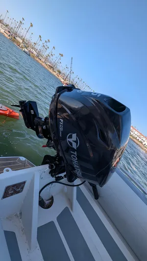 Hamlet Yacht Photos Pics 2023 Leopard Powercat with Tohatsu outboard motor on a calm waterway.