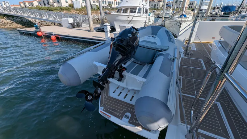 Hamlet Yacht Photos Pics 2023 Leopard Powercat with inflatable boat and outboard motor docked at marina.