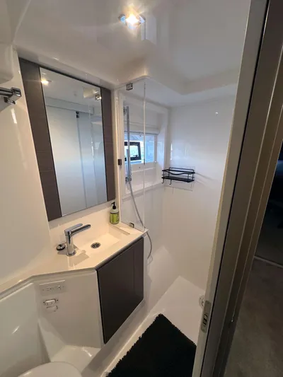 Hamlet Yacht Photos Pics Modern bathroom in 2023 Leopard Powercat yacht with sleek fixtures and ample lighting.