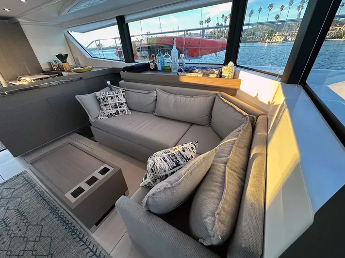 Hamlet Yacht Photos Pics Luxurious interior of 2023 Leopard Powercat yacht with plush seating and scenic window views.