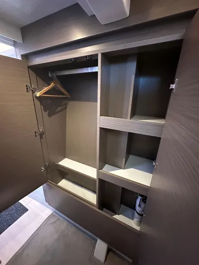 Hamlet Yacht Photos Pics 2023 Leopard Powercat interior closet with shelves and hangers.
