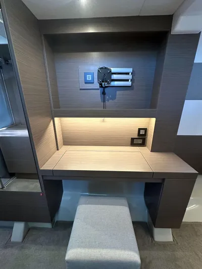 Hamlet Yacht Photos Pics Modern desk area in 2023 Leopard Powercat yacht cabin with stool and wall-mounted TV bracket.