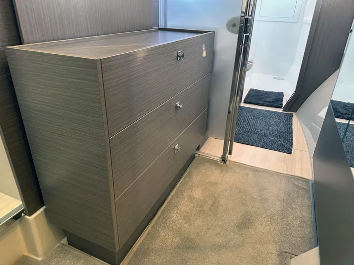 Hamlet Yacht Photos Pics Modern interior of 2023 Leopard Powercat featuring sleek wooden cabinetry and carpeted flooring.