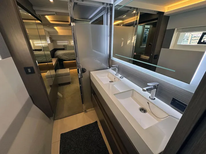 Hamlet Yacht Photos Pics Luxurious bathroom in 2023 Leopard Powercat yacht with dual sinks and modern design.