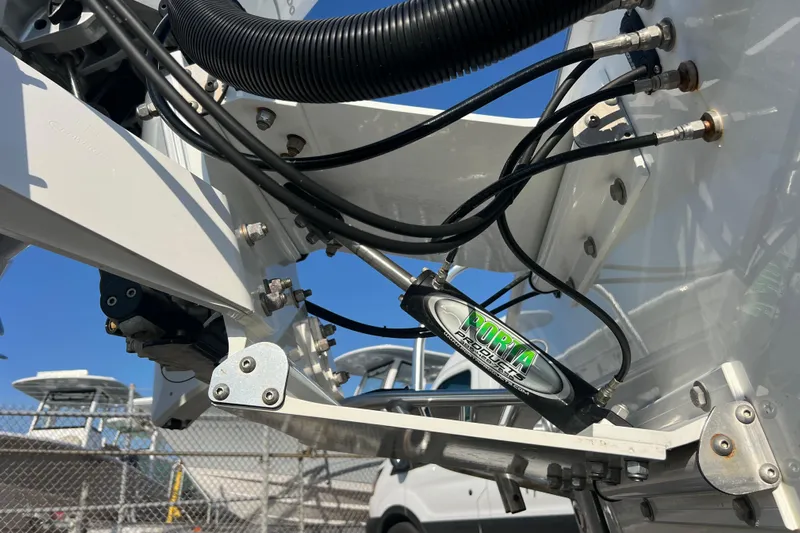  Yacht Photos Pics Close-up of 2024 Andros Tarpon 26 boat's hydraulic steering system and cables.