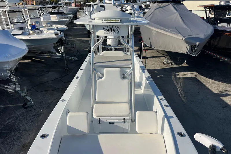  Yacht Photos Pics 2024 Andros Tarpon 26 boat, white interior, docked among other boats.