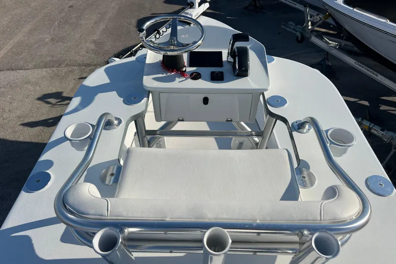  Yacht Photos Pics 2024 Andros Tarpon 26 boat console with steering wheel and seating.