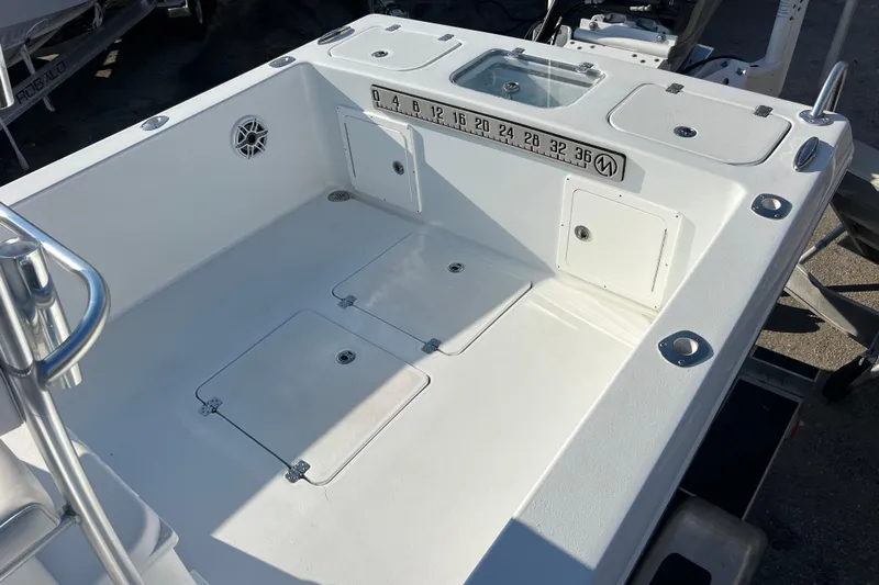  Yacht Photos Pics 2024 Andros Tarpon 26 boat deck with storage compartments and measurement scale.
