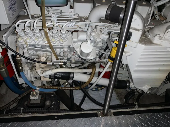 Why Knot Yacht Photos Pics Engine compartment of a 2001 Carver 396 Motor Yacht, showcasing intricate mechanical components.