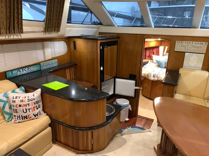 Why Knot Yacht Photos Pics Interior of 2001 Carver 396 Motor Yacht with cozy seating and modern amenities.